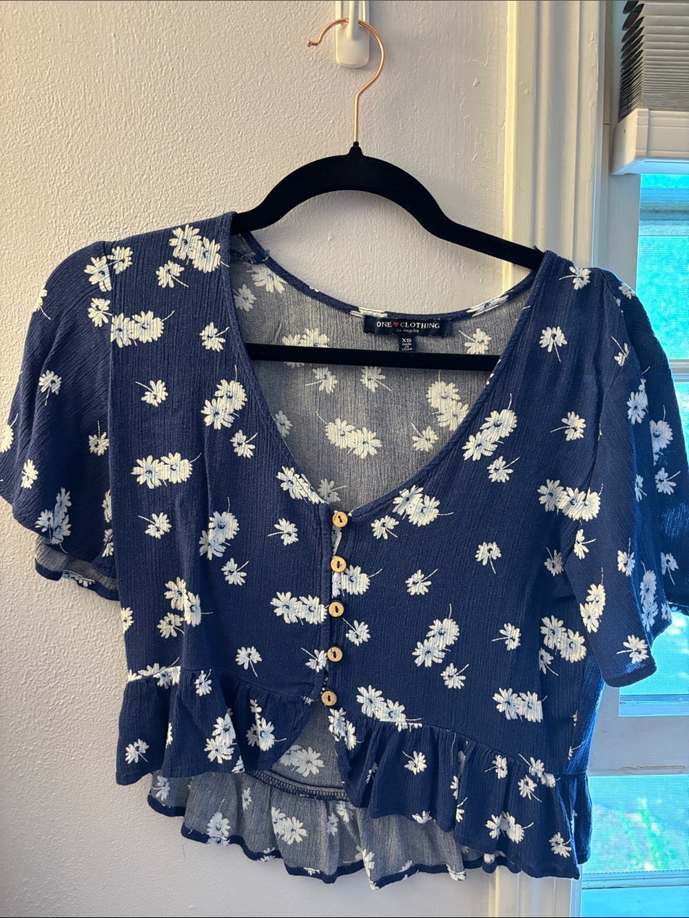 Blue floral button-front ruffle crop top